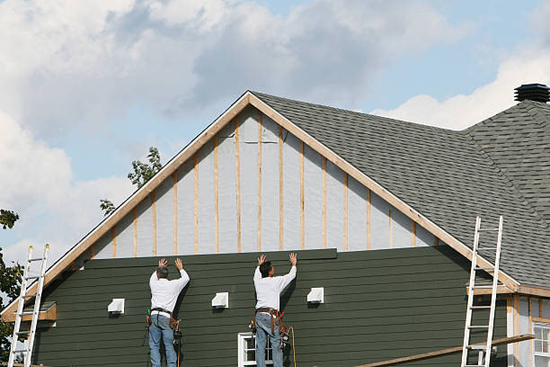 Professional Siding Installation technician working in Locust Grove, GA